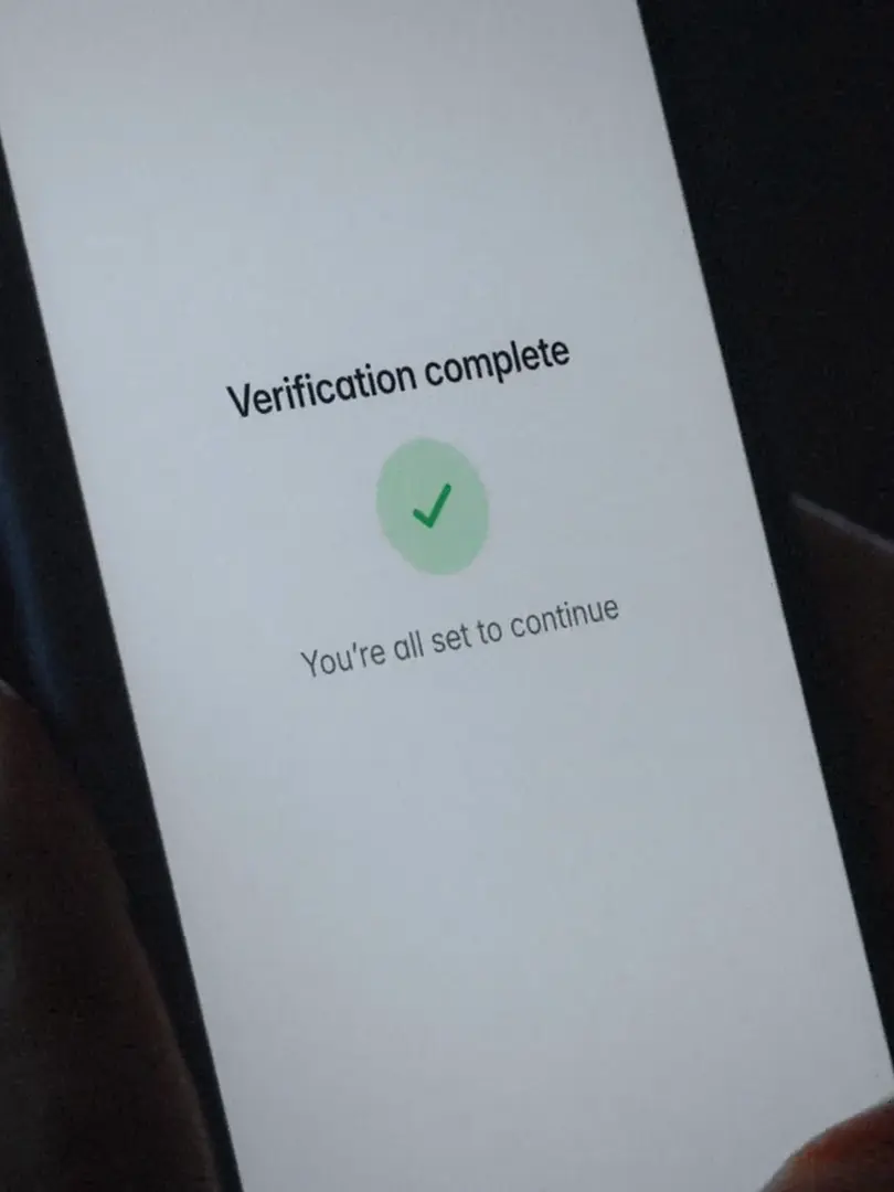 The Agemin result on the phone: Verification complete, you're all set to continue.